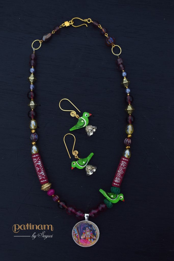 Andal and parrot necklace