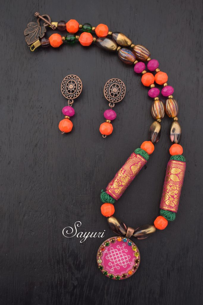 pink and orange kolam necklace by Divya N