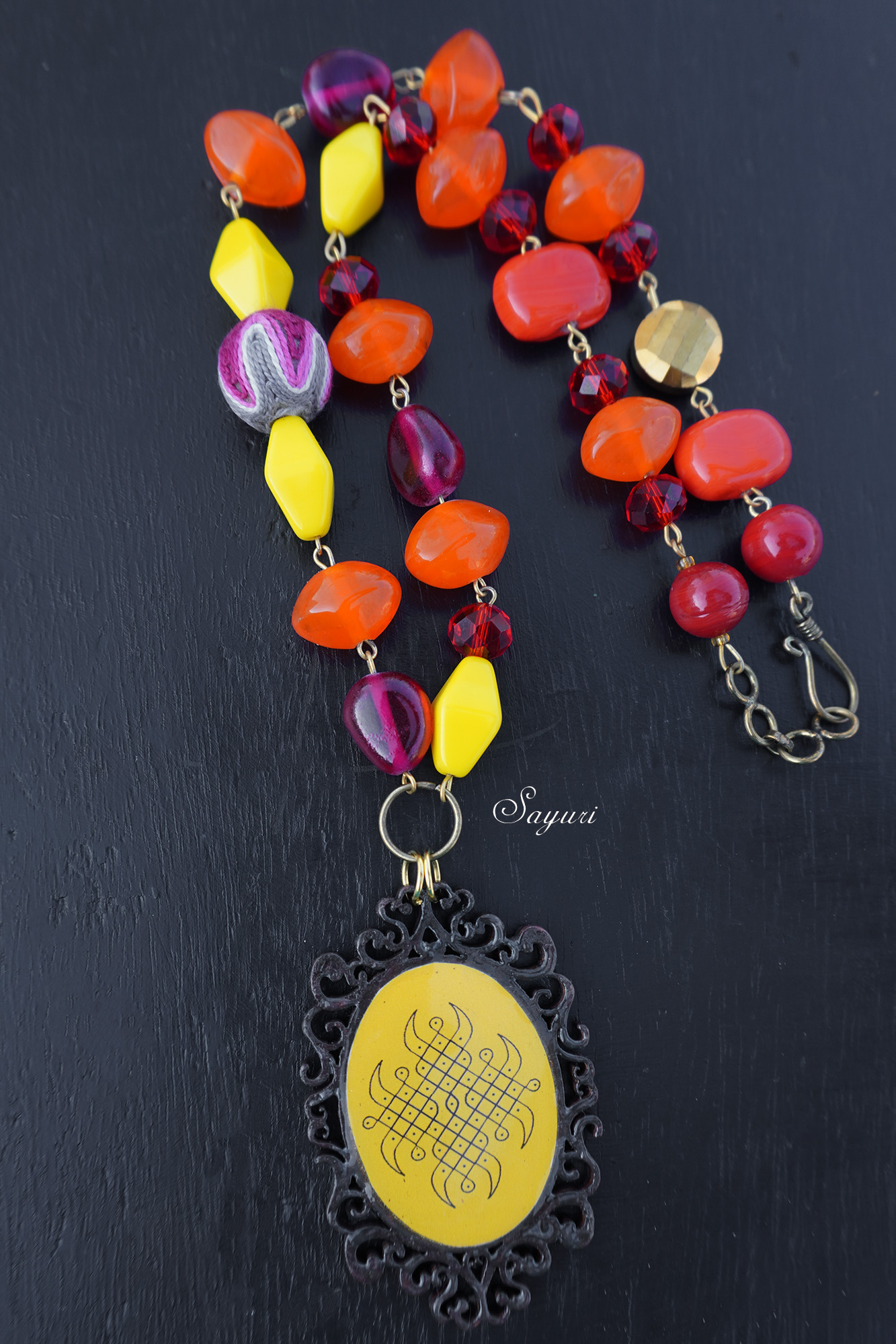 Wooden kolam pendant with bright glass beads